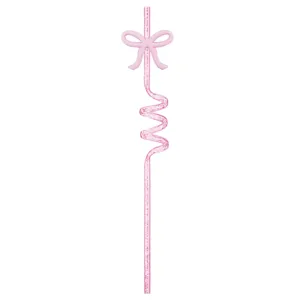 Pink party straw detail shot showing cute bow decoration and shiny glitter spiral design.