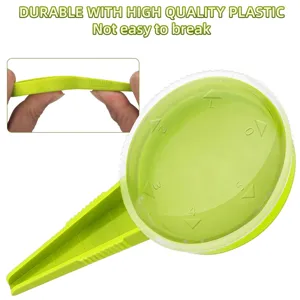Green adjustable plastic seed dispenser with 5 gear dials for easy garden planting tasks.
