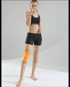 Detail view of thermal knee braces worn by model, providing joint warmth and support.