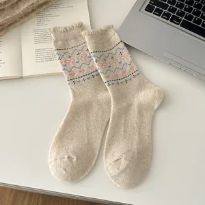 Nordic style wool blend mid-tube socks featuring cute heart and bow patterns for women.