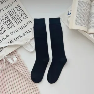 Chaussettes hautes noires pour femmes, chaussettes longues en tricot pour le quotidien.
