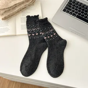 Cozy dark grey wool mid-tube socks featuring cute pink heart and bow Fair Isle Nordic knit pattern.