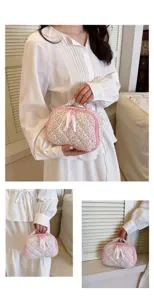 Floral quilted cosmetic bag with pink bow handle portable makeup storage pouch for women daily use.