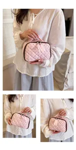 Pink quilted cosmetic bag detail shot showing cute polka dots, soft cotton fabric and zipper.