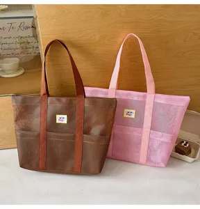 Large mesh tote bag for travel and beach use, portable single-shoulder storage bag for daily.