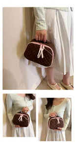 Cute brown polka dot quilted cosmetic bag cotton toiletry storage pouch for daily travel use.