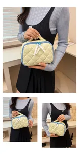 Quilted cosmetic bag with polka dots, cute storage pouch and makeup organizer for daily use.