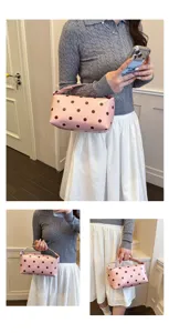 Pink polka dot handbag for women, stylish PU leather cosmetic and makeup storage bag.