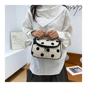 Large capacity polka dot cosmetic bag portable toiletry organizer for daily travel use.