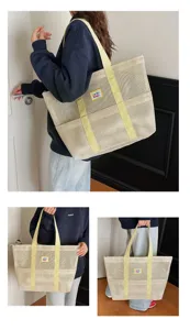 Large mesh tote bag with dual yellow handles and front pocket, perfect for beach and travel.