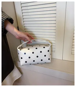 Minimalist white black polka dot PU leather cosmetic bag handbag makeup storage pouch detail