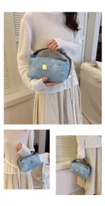 Retro denim makeup handbag with brown handle, large capacity portable cosmetic storage bag.