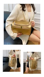 Detail view of gold PU leather cosmetic bag with metal zippers, portable and spacious.