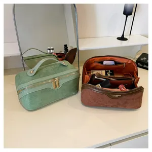 Large capacity suede cosmetic bag with multiple compartments and stylish pillow design.