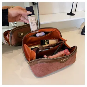 Large capacity suede makeup bag with multi-compartment design for travel and daily storage.