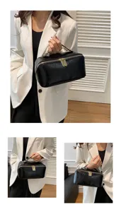 Black PU leather cosmetic bag with large capacity, ideal for travel and daily makeup storage.