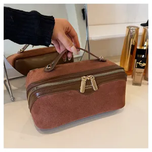 Brown velvet makeup bag with handle and zipper, large capacity travel cosmetic organizer.