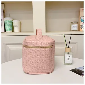 Pink PU woven cosmetic bag with handle, large capacity travel makeup organizer box for women.