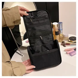 Detailed view of black hanging toiletry bag with multiple mesh compartments and secure hooks.