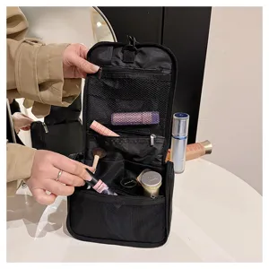 Black hanging toiletry bag with large capacity, multi-compartment mesh cosmetic organizer.