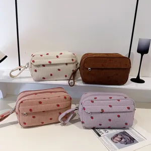 Corduroy cosmetic bag with cute strawberry pattern, large capacity portable travel makeup pouch.