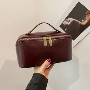 Solid color PU leather cosmetic bag, large capacity travel makeup storage organizer pouch.
