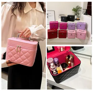 Portable quilted makeup bag with handle, stylish PU leather cosmetic organizer case.