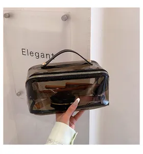 Borsa cosmetica trasparente in PVC con manico grigia trousse da viaggio per trucco impermeabile.