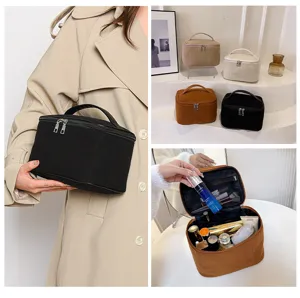 Corduroy cosmetic bag with large capacity, portable travel makeup organizer pouch with zipper.