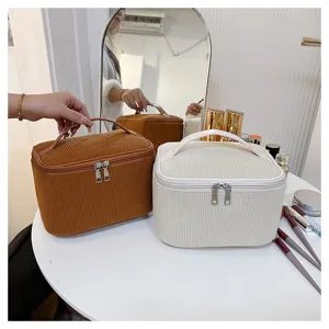 Corduroy cosmetic bag with handle, large capacity portable makeup storage pouch for daily travel.
