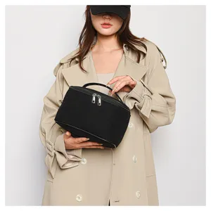 Black corduroy cosmetic bag, large capacity portable storage pouch with handle and dual zippers for travel.