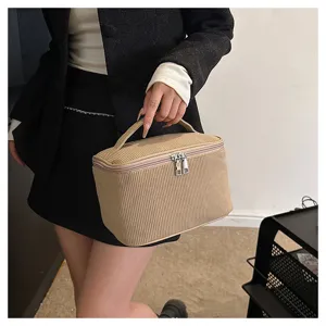 Corduroy cosmetic bag storage pouch, minimalist portable makeup case with double zipper design.