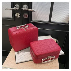 Red quilted makeup vanity bag travel cosmetic organizer case with metal handle and spacious interior.