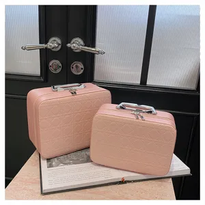 Pink quilted cosmetic bag set, elegant PU leather makeup organizer with silver handle detail.