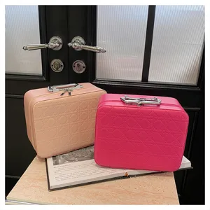 Pink cosmetic storage bag with classic quilted design, large capacity vanity case for travel.