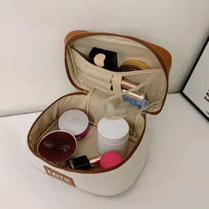 Portable PU diamond lattice color block cosmetic bag with large capacity and multi pockets.