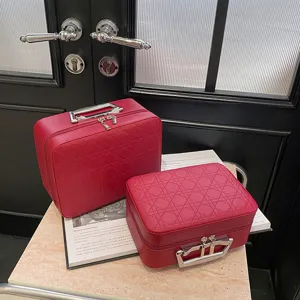 Red quilted cosmetic bag vanity case large capacity makeup storage box with metal handle.