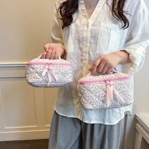Quilted floral cosmetic bag, portable makeup pouch with bow, travel toiletry organizer