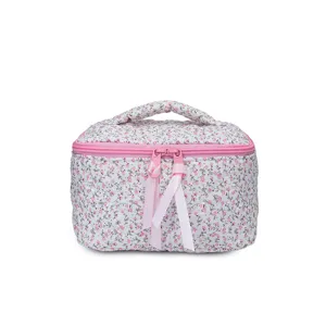 Quilted floral cosmetic bag for women, cute makeup storage pouch with zipper and handle.