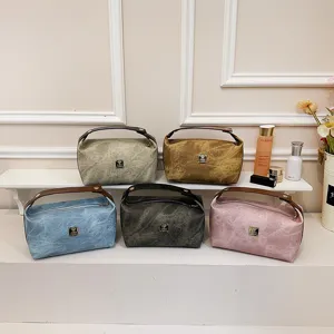 Vintage PU leather cosmetic bag with handle, large capacity retro wash pouch for travel.