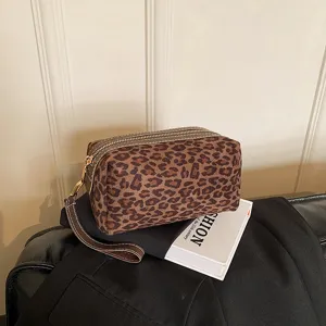 Vintage leopard print makeup bag, portable travel toiletry pouch with zipper and wrist strap.