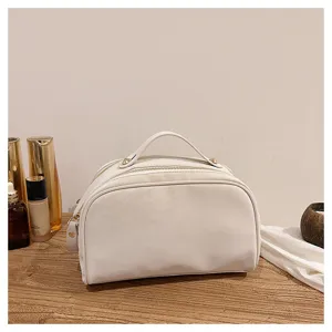 White leather cosmetic bag with top handle, elegant vintage makeup storage pouch for daily travel.