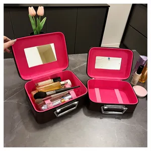 Portable makeup train case with mirror and brush holder, stylish retro cosmetic storage bag.