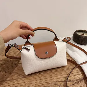 Women leather contrast color dumpling handbag top handle cross body bag main view display
