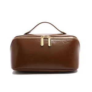 Brown PU leather cosmetic bag, large capacity travel wash bag, solid color storage pouch.