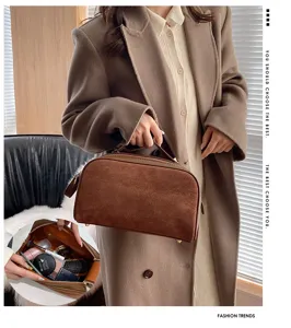 Large capacity suede cosmetic bag with handle and zipper closure for travel and daily use.