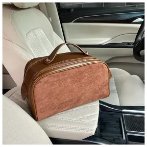 Large capacity brown cosmetic bag with leather and suede texture, stylish travel makeup organizer.