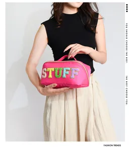 Pink nylon cosmetic bag with colorful flocked letters, large capacity toiletry organizer.
