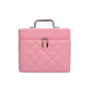 Pink quilted cosmetic bag with handle, portable makeup case for travel and daily storage.