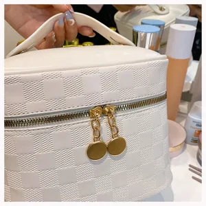 White PU leather cosmetic bag with checkered pattern, portable makeup storage vanity case.